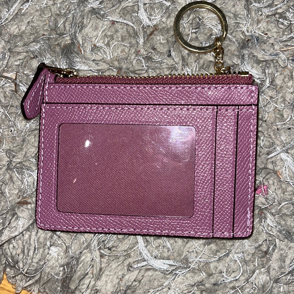 Little purple coin wallet FAKE COACH I think
